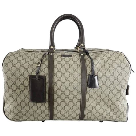 gucci gg duffle bag sale|Gucci rolling duffle bag.